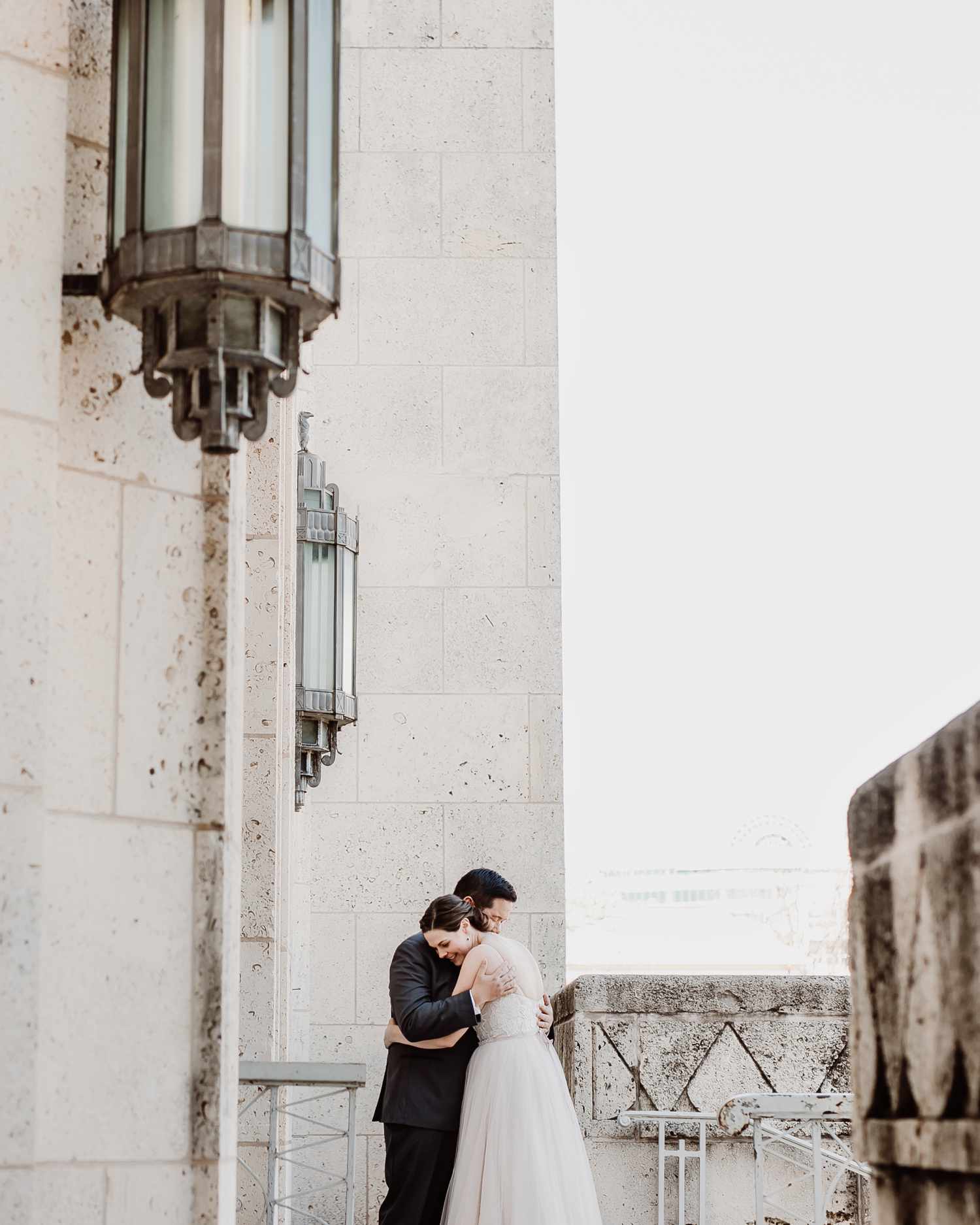 city hall wedding bride and groom hugging