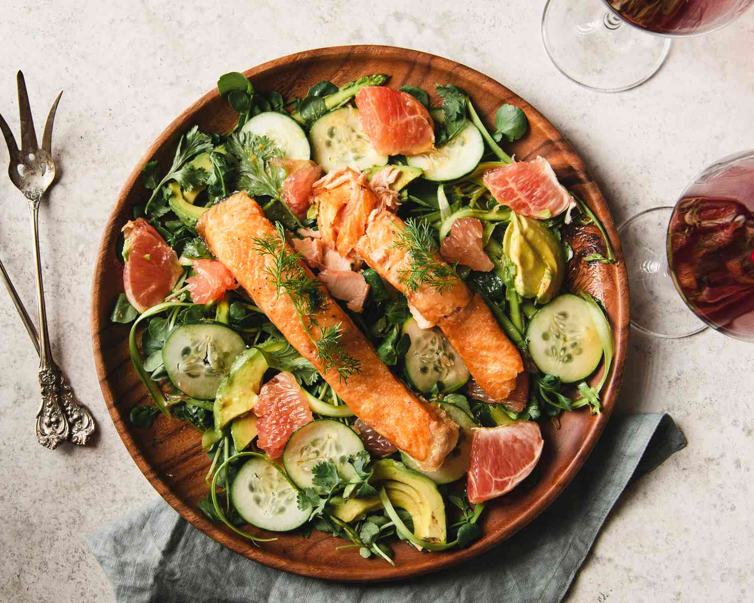 Flat lay of slices of Salmon over watercress salad