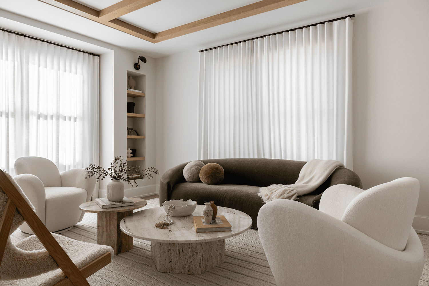 a white room with sheer curtains