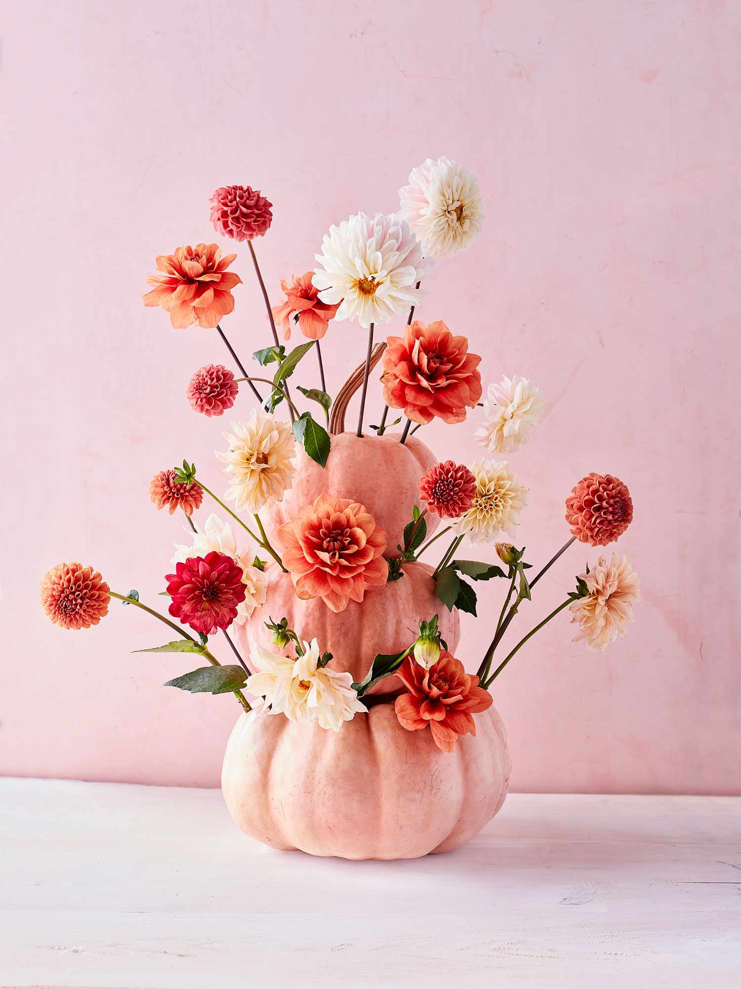 Thanksgiving centerpiece with pink pumpkins and flowers