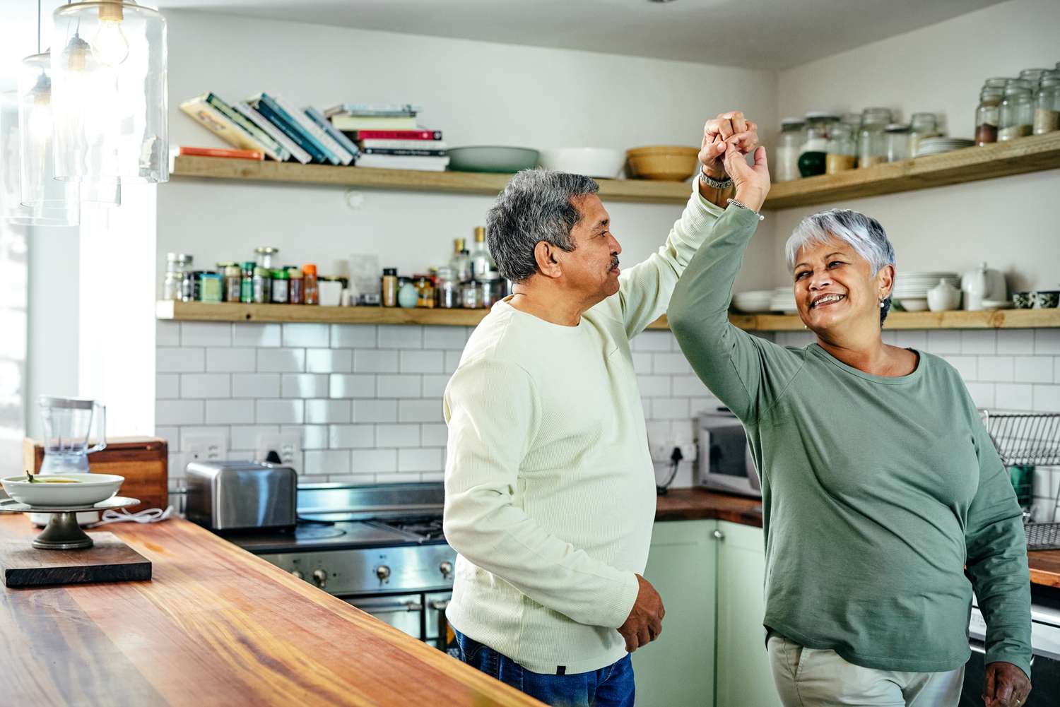older couple dancing in kitchen