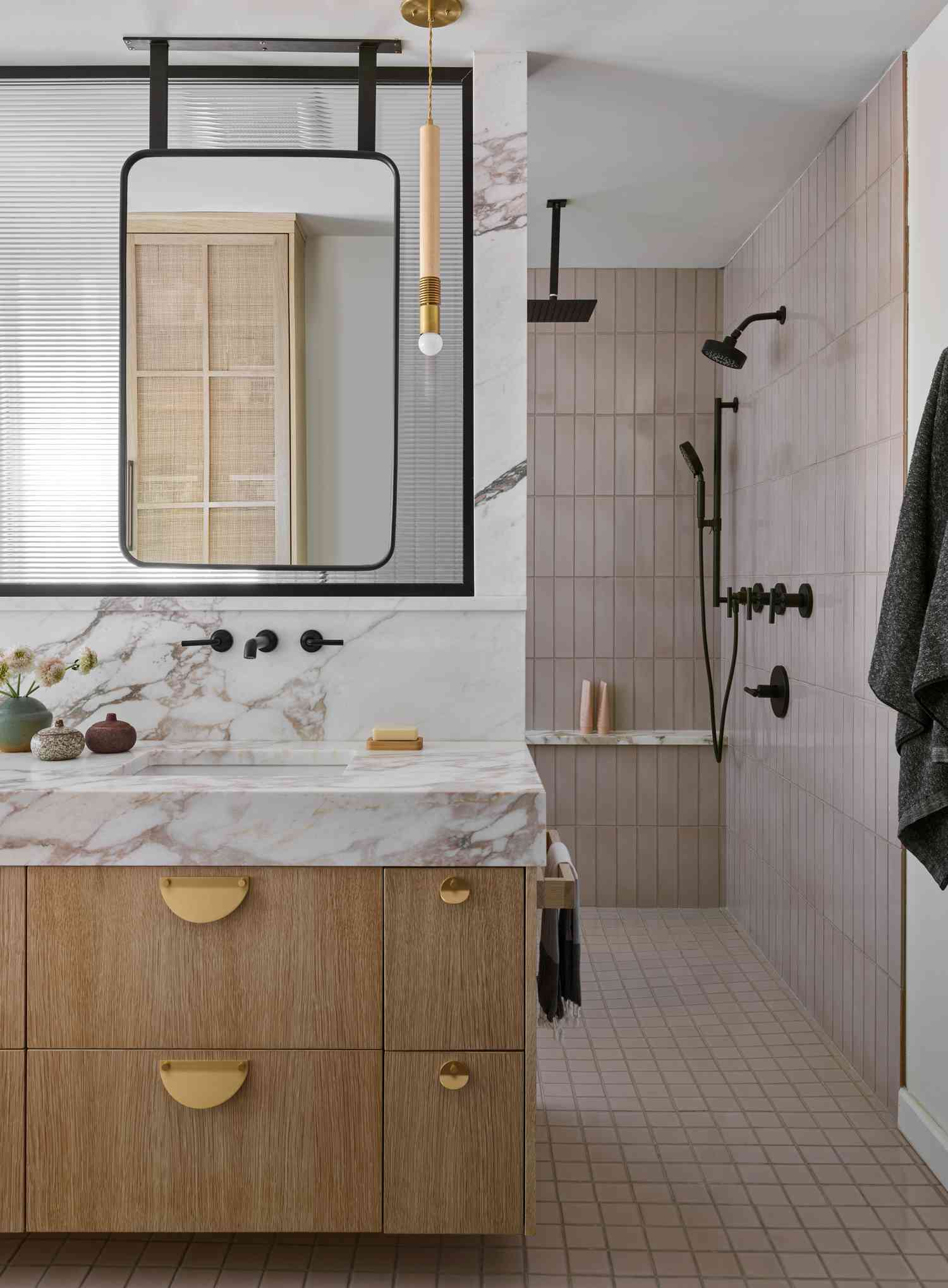 walk in shower in white bathroom