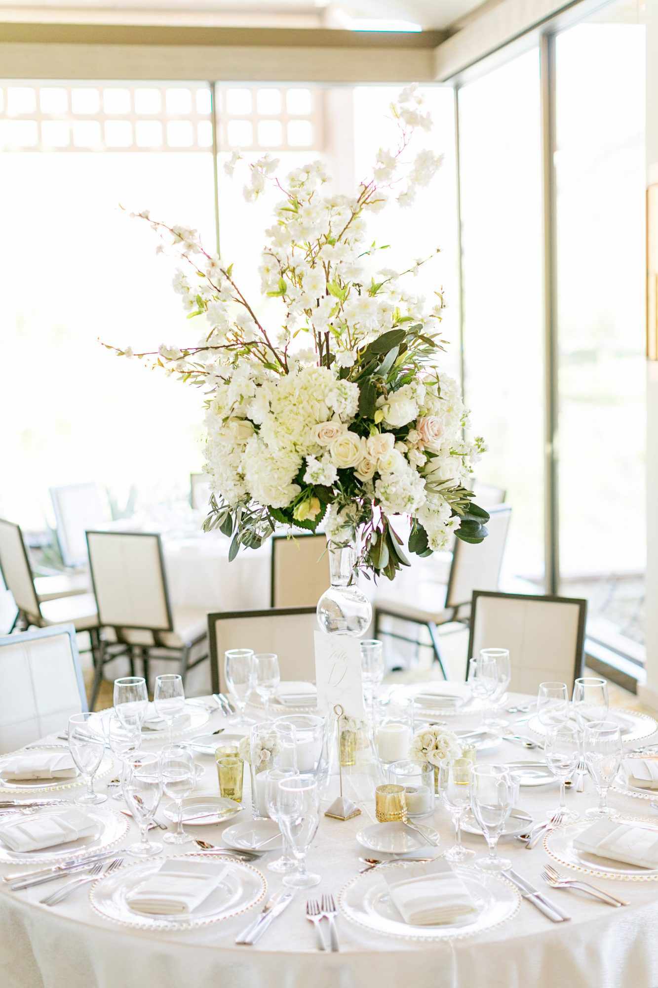 tall centerpiece with white garden roses