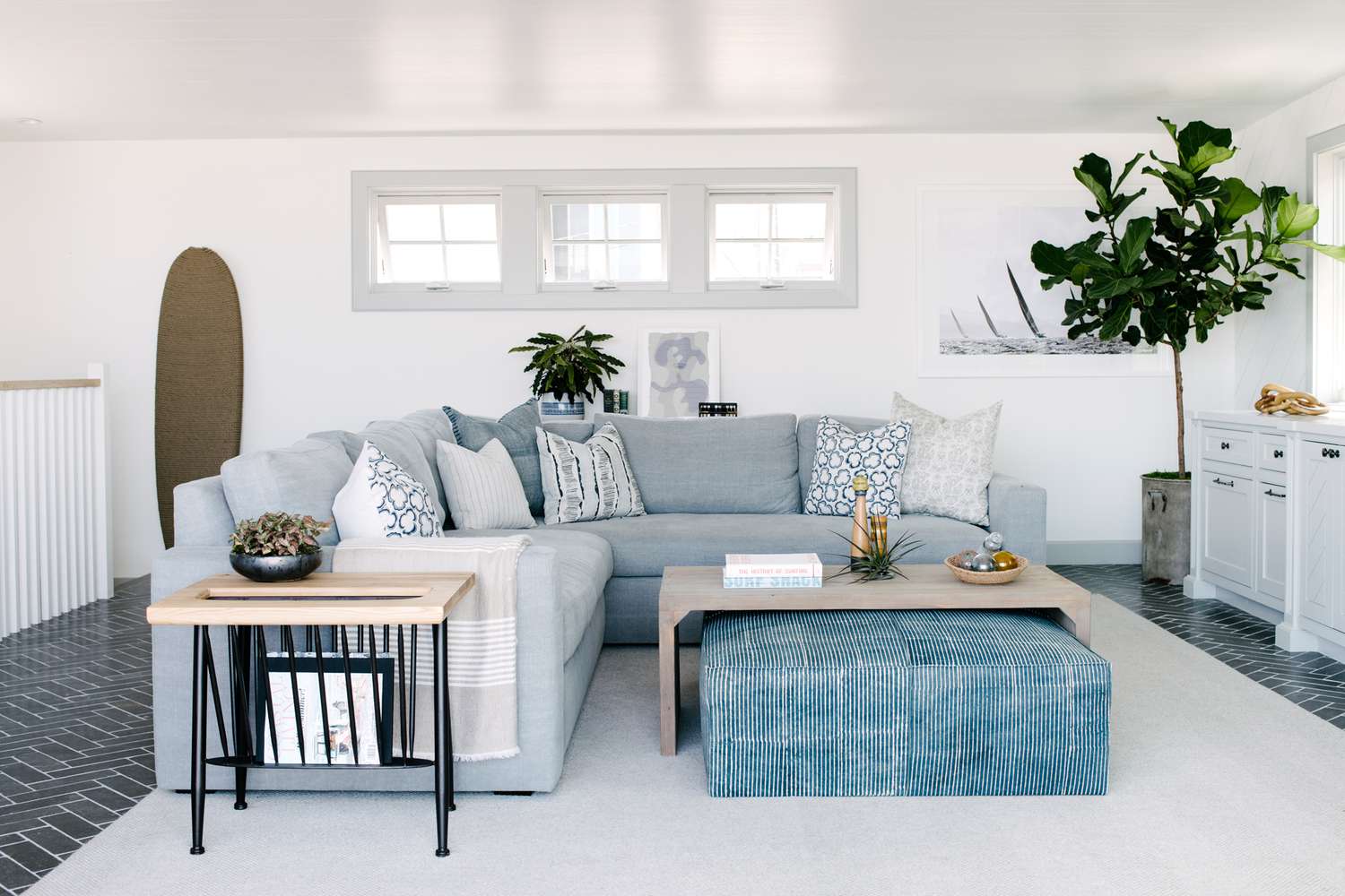 pale blue sectional with large ottoman under coffee table