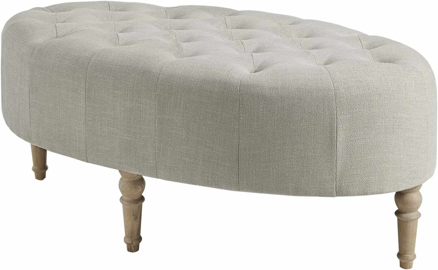 Oval ottoman with tufted upholstery and four wooden legs