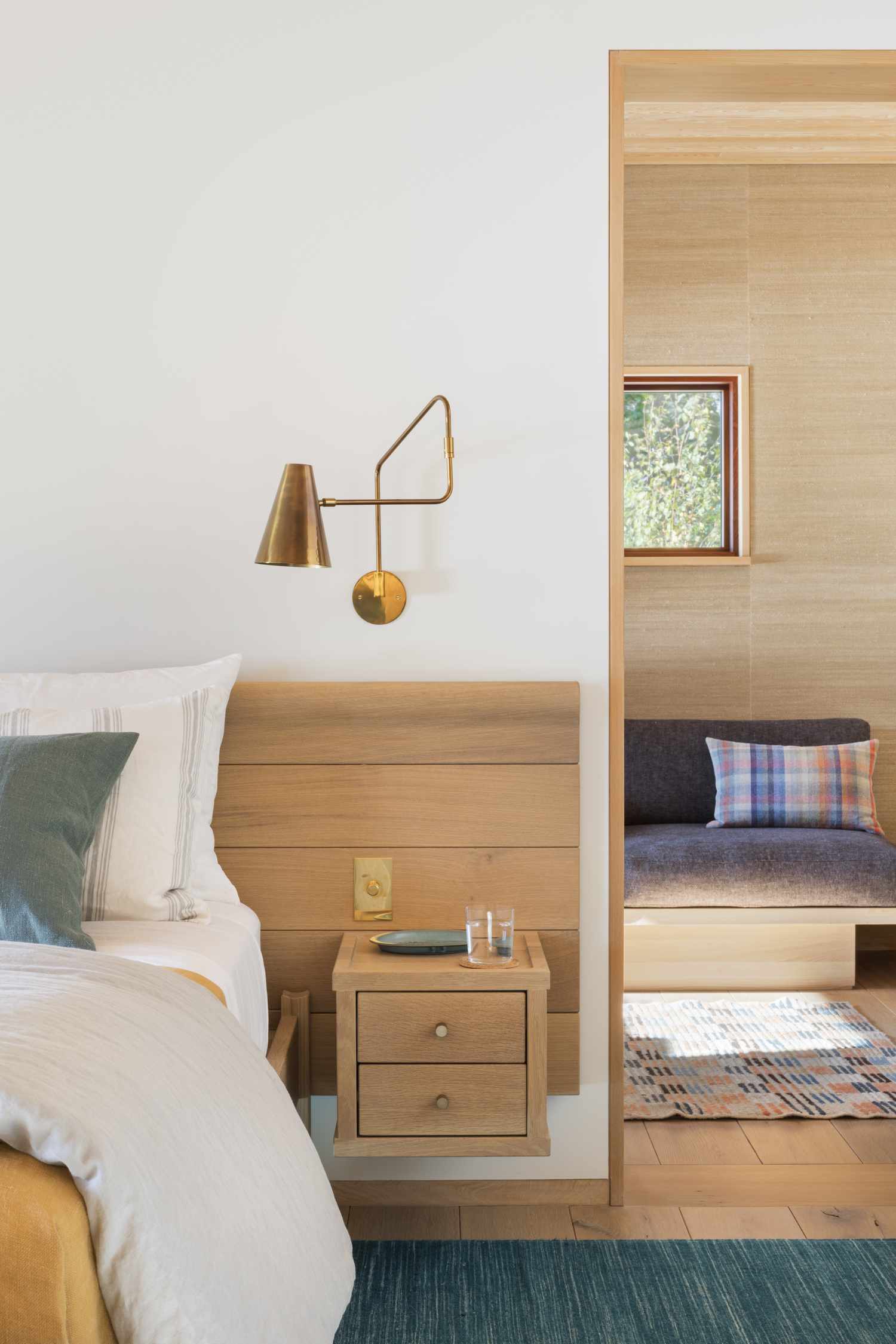 a beachy home with natural wood in the bedroom