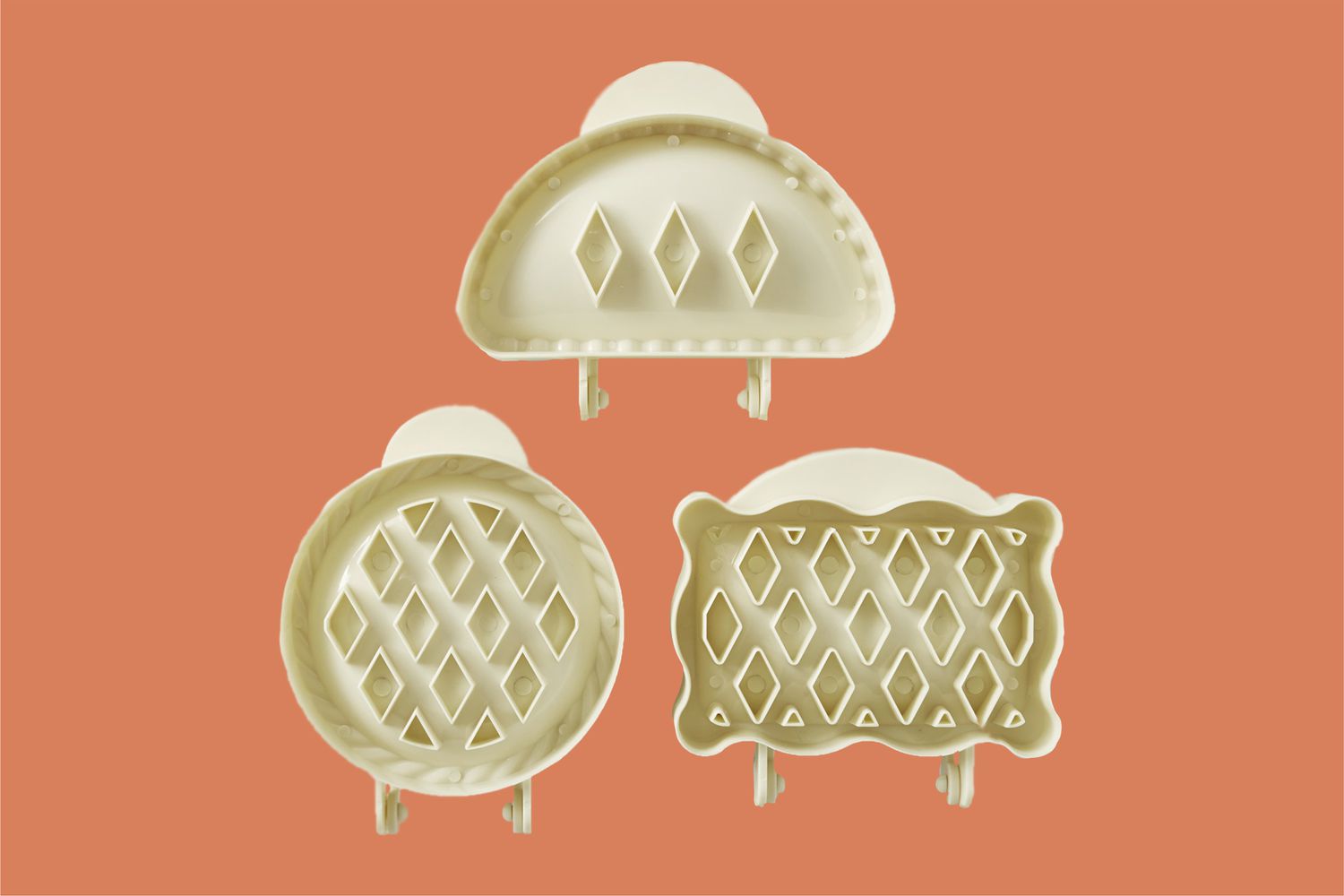 mini hand pie molds on an orange background