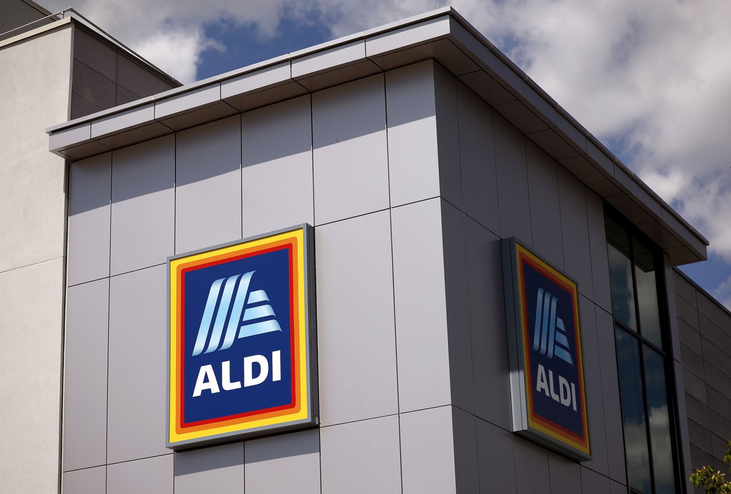 Exterior of an Aldi supermarket showing its logo on the building wall