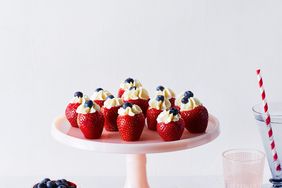 filled strawberries on cake platter