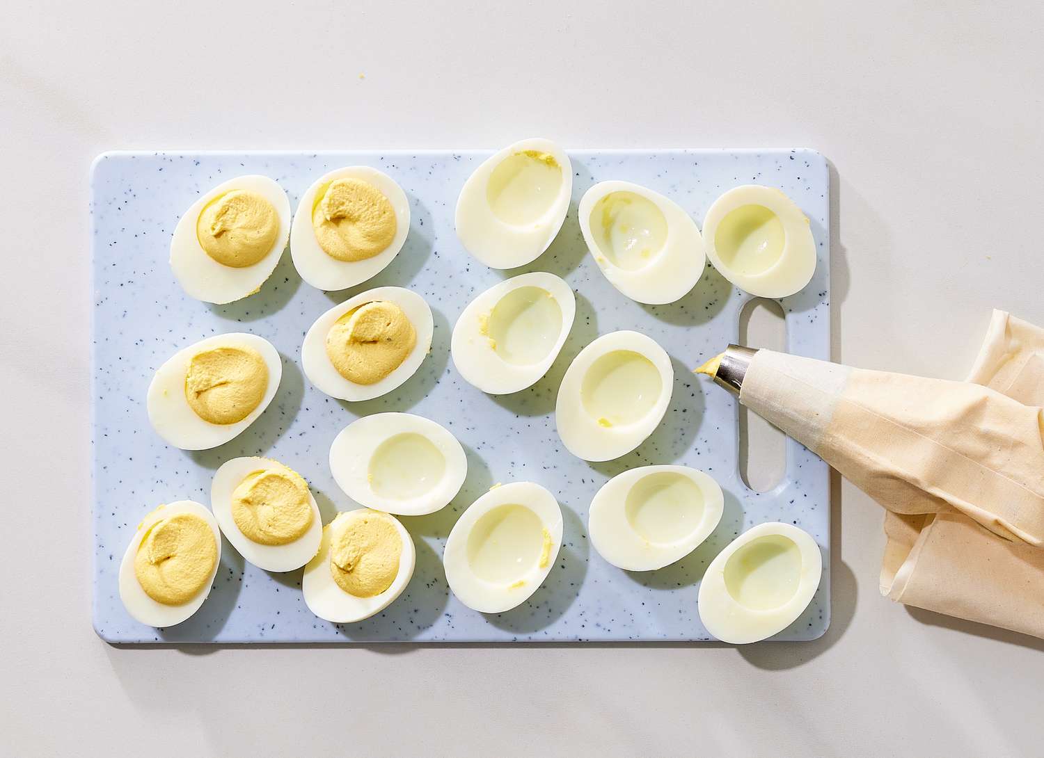 overhead view of hard boil eggs being filled into eggs