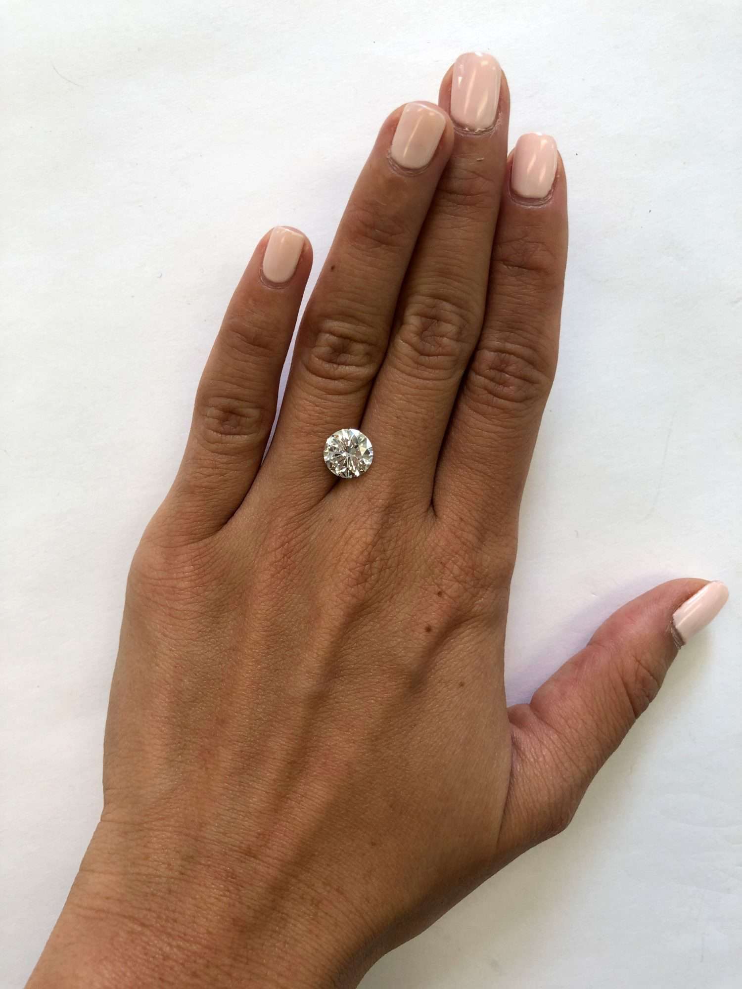 hand with 2 carat diamond