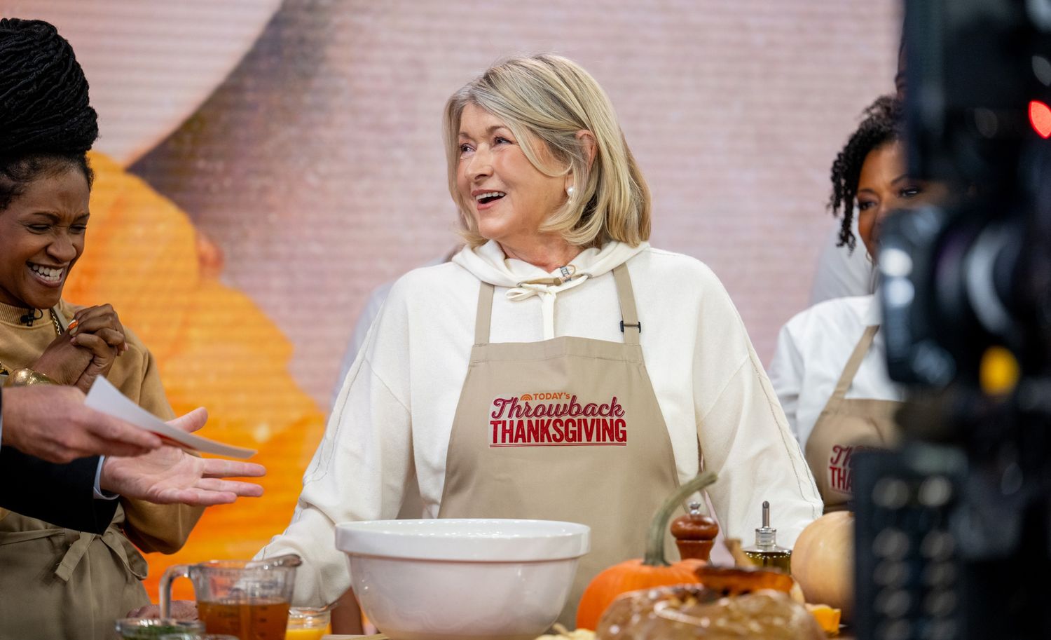 decorvow cooking on a Thanksgivingthemed show wearing an apron