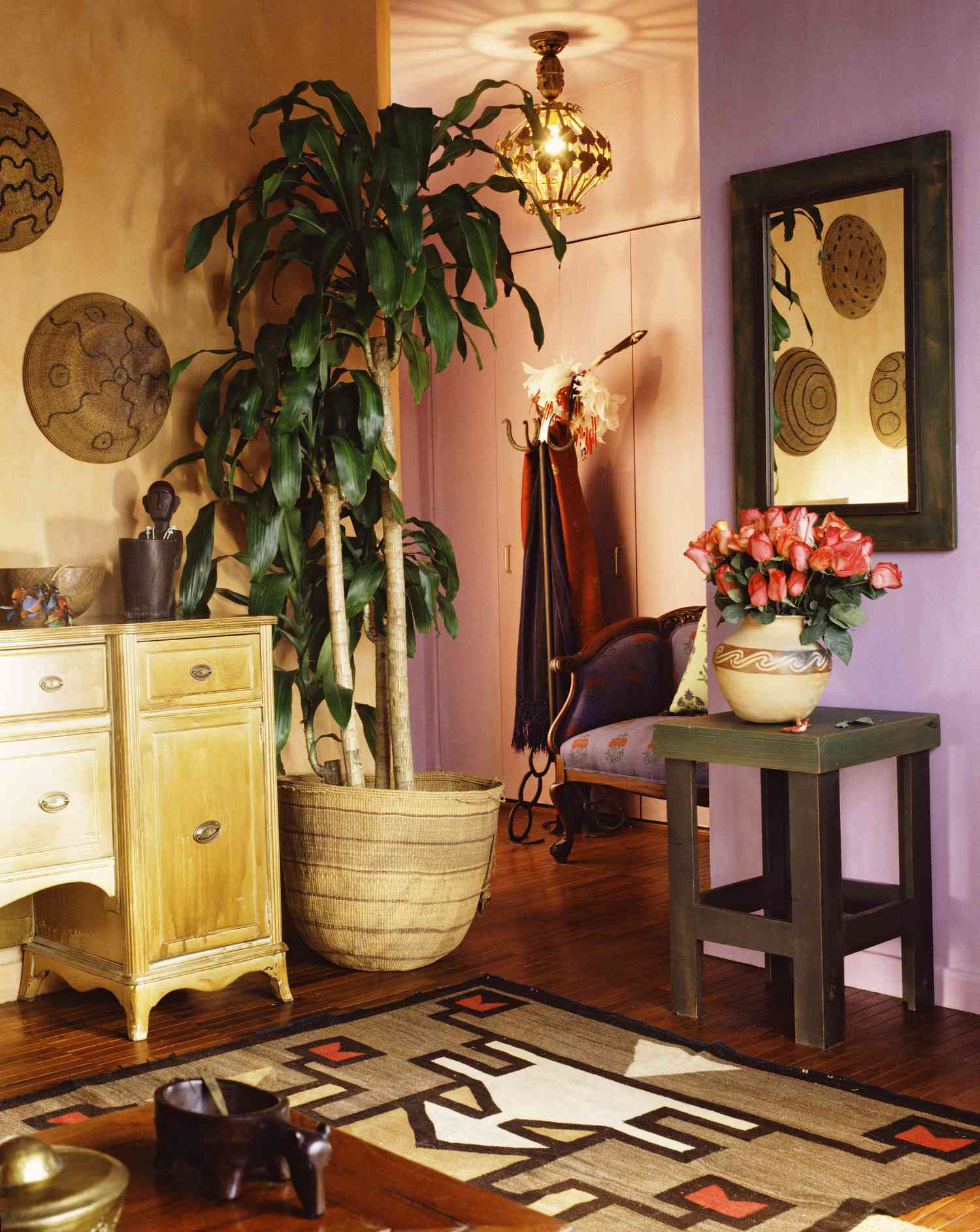 room with eclectic decor and purple wall
