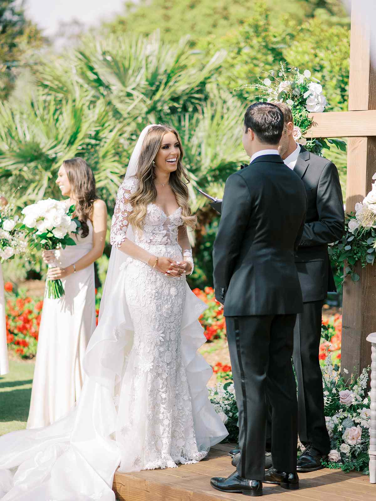 bride smiling at groom during outdoor wedding ceremony