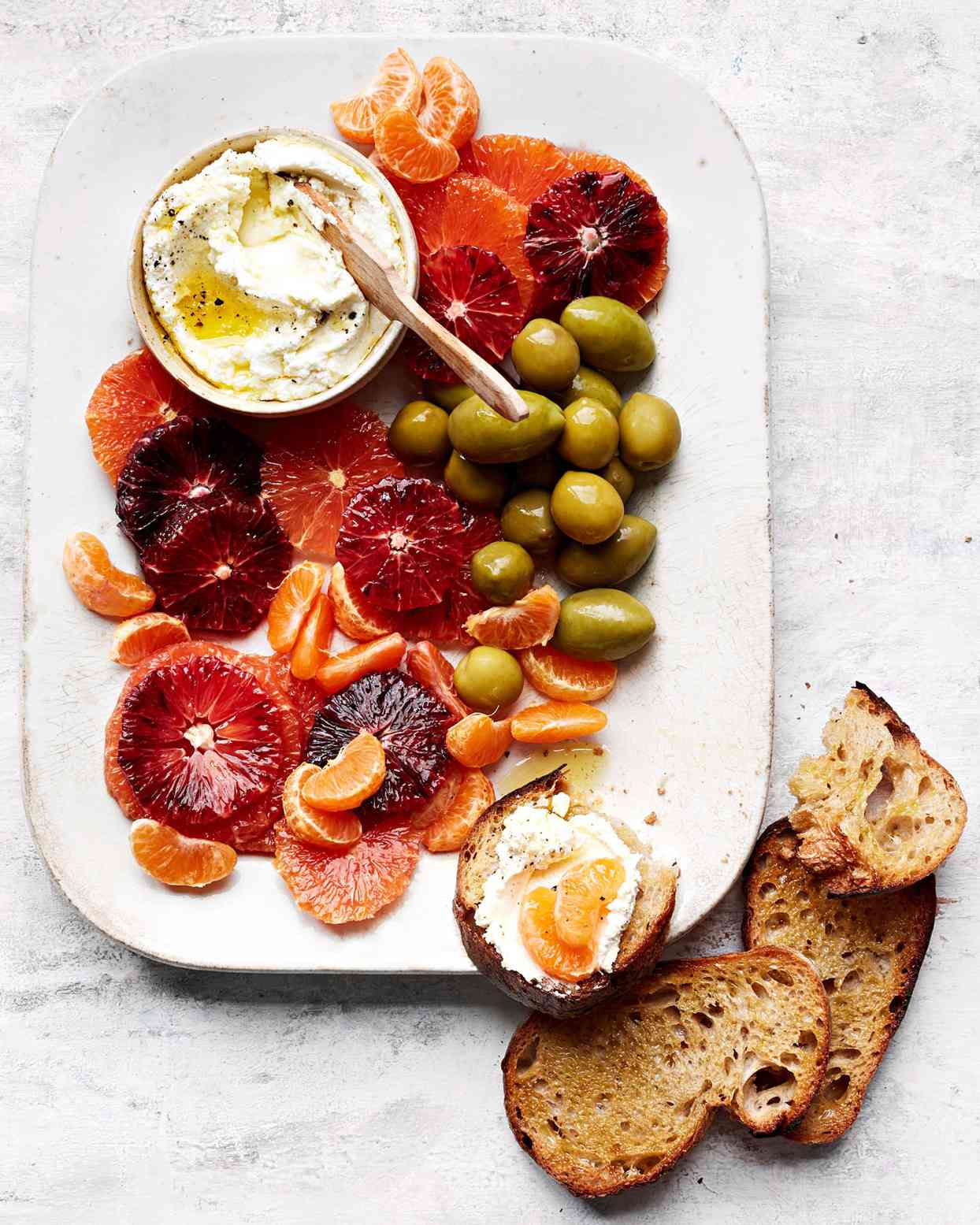 citrus and greens with olives and goat cheese