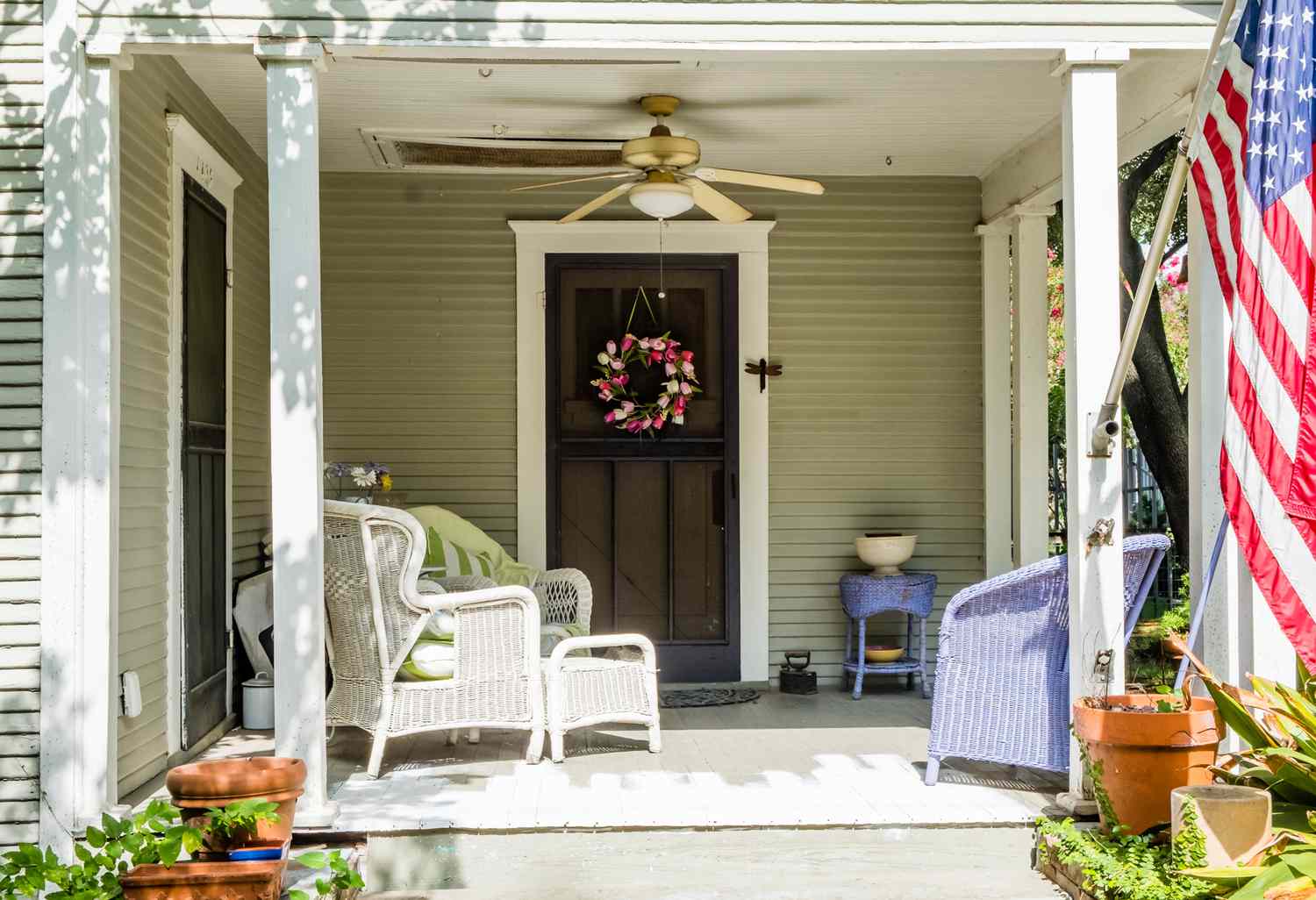 front porch with ceiling can and wicker furniture