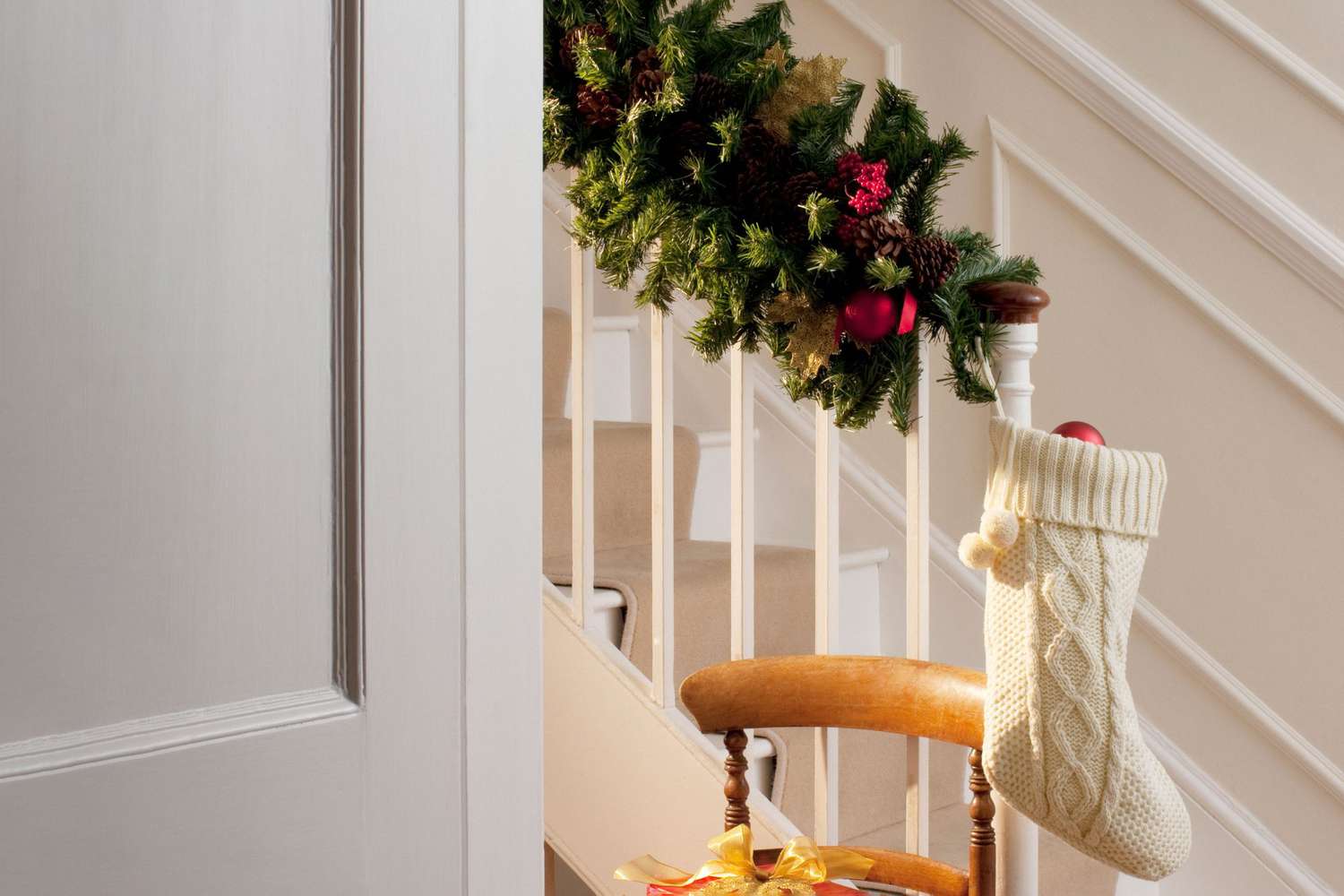 Christmas garland along stairwell in home