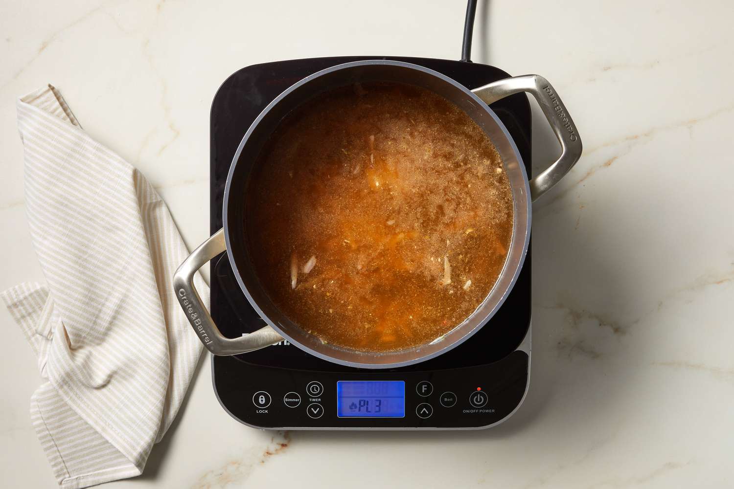 overhead view of a pot of soup cooking