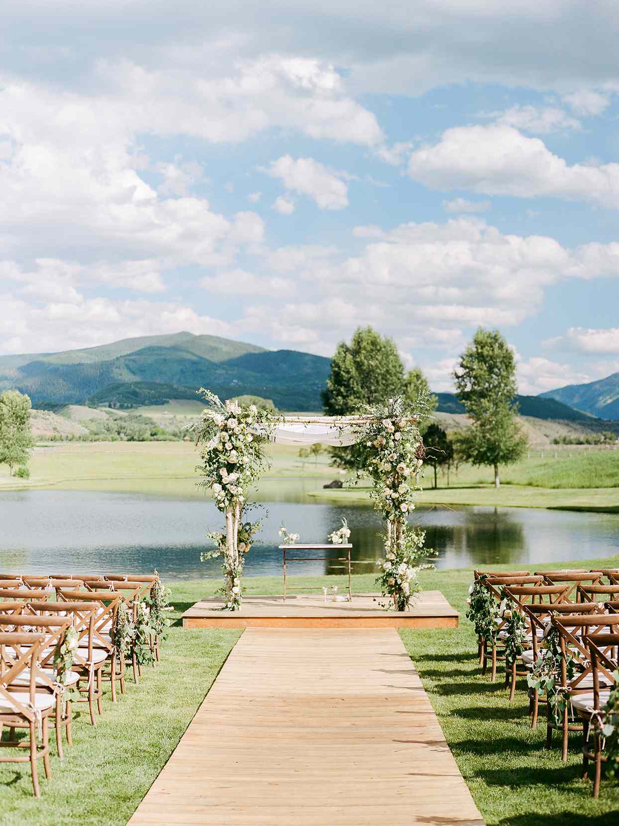 jessica aaron wedding ceremony location with water with mountain backdrop