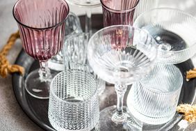 Group of empty glasses on concrete background