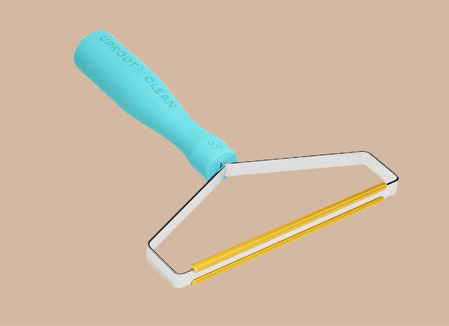 pet removal tool on a tan background