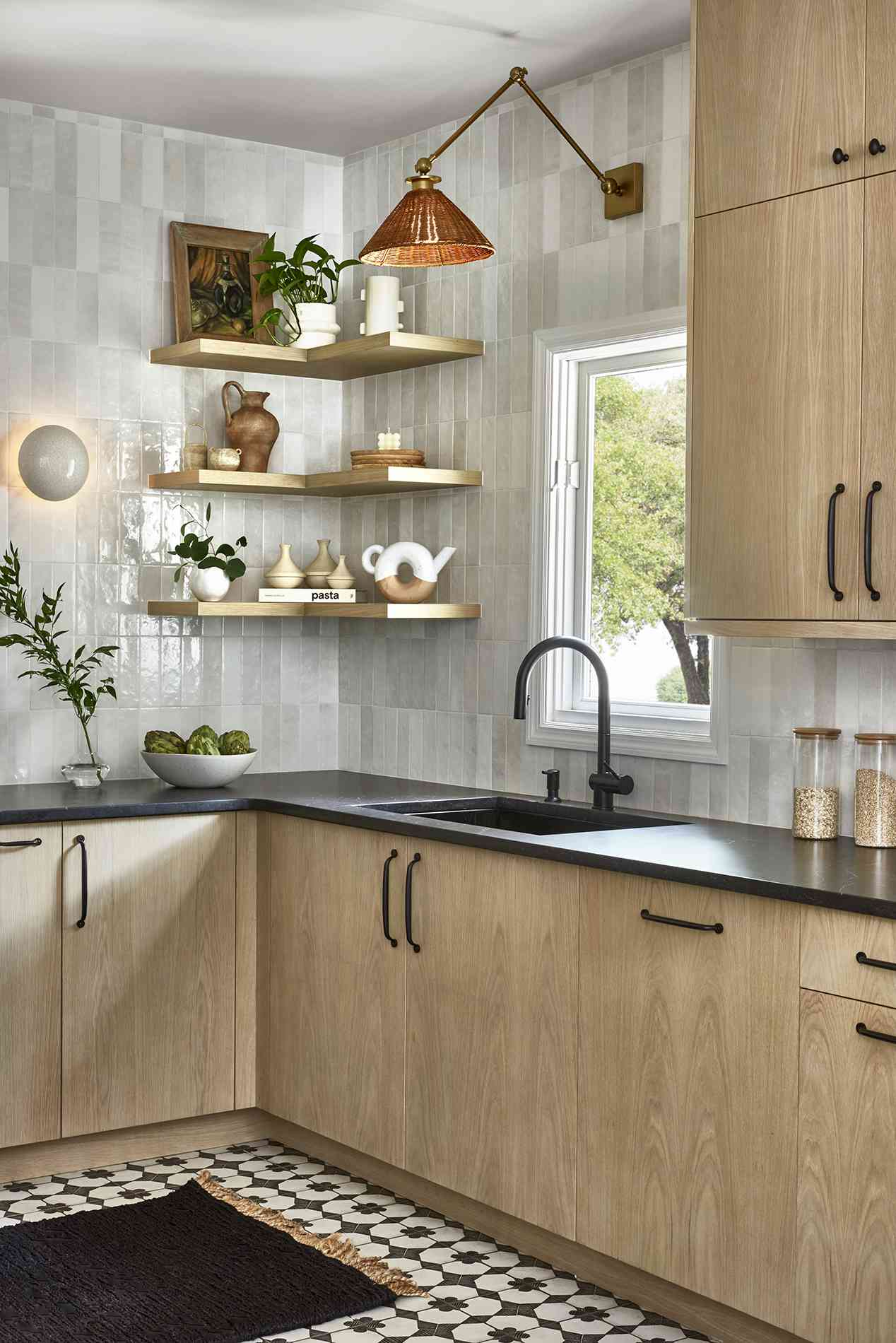 wood cabinets with copper sconce