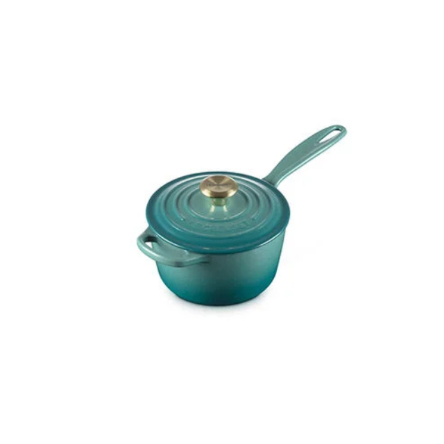 A small cooking pot with a lid and handle