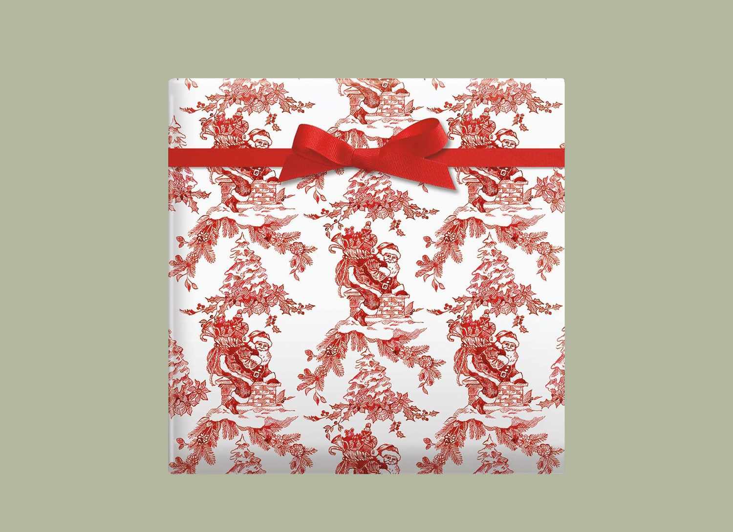 gift wrapped in Santa toile red and white paper on a green background