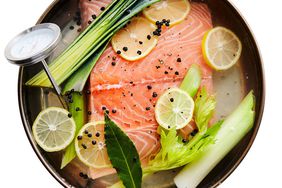 Cold-Poached Salmon in skillet with thermometer