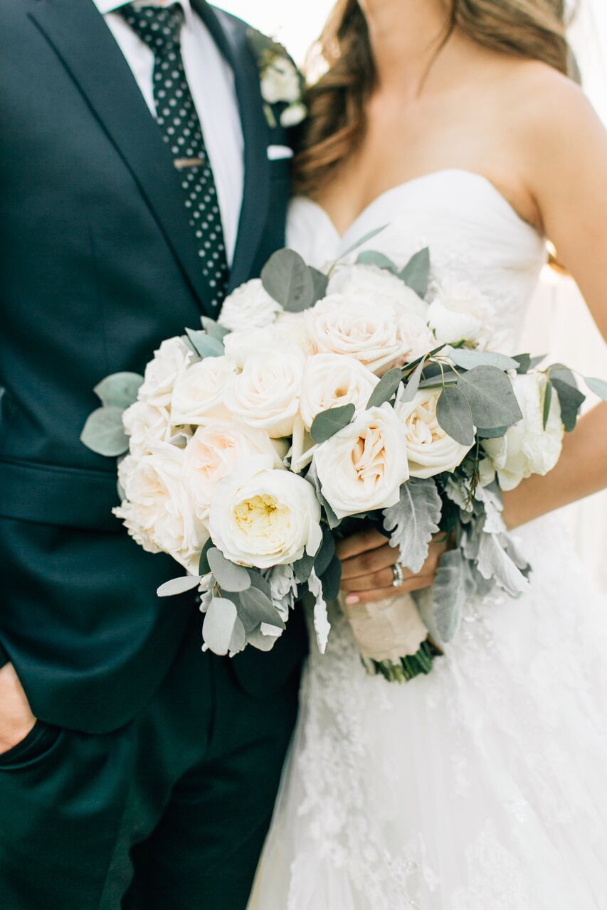 bride and groom with white bouquet