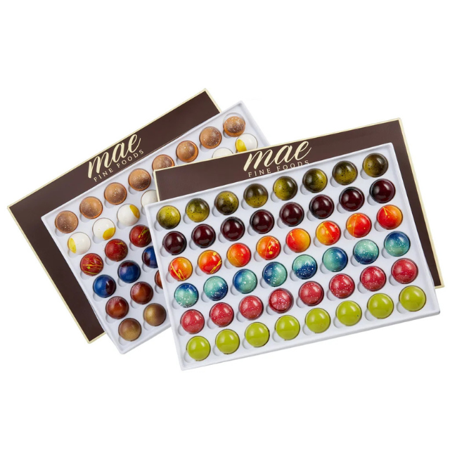Boxes of assorted chocolates arranged in colorful patterns