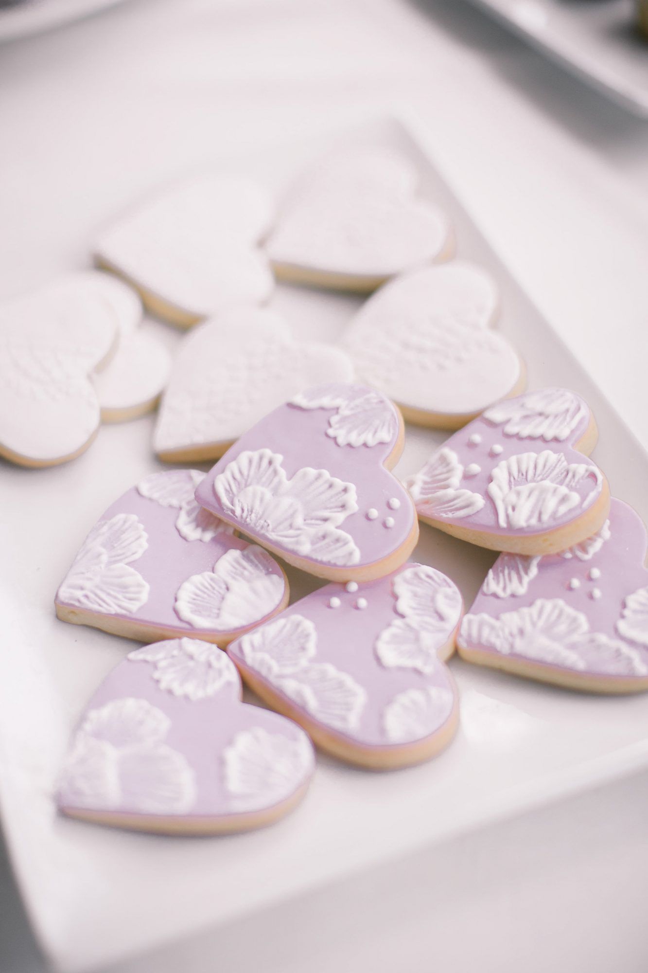 lilac and white floral frosted heart shaped cookies