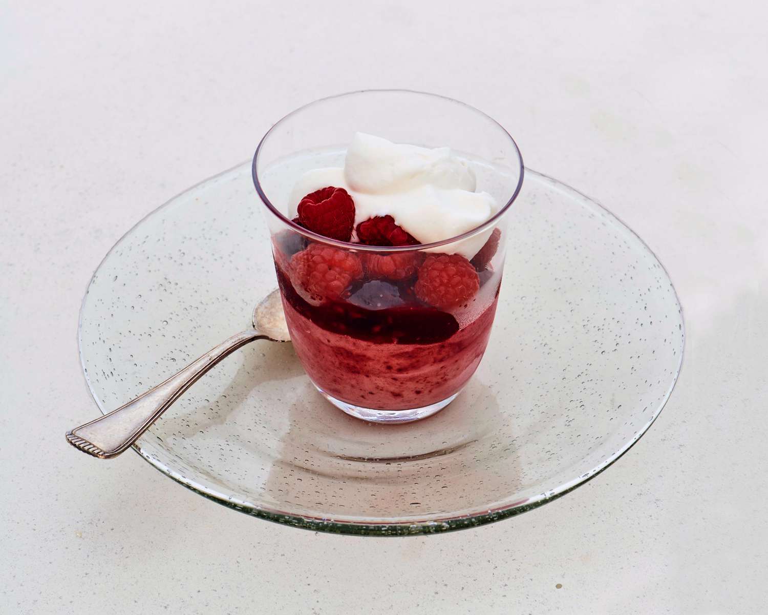 cherry-raspberry semifreddo topped with whipped cream