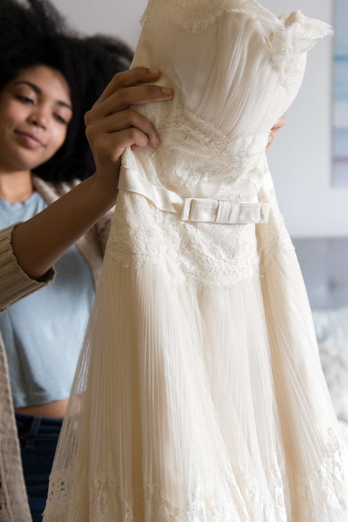 woman holding lacy dress