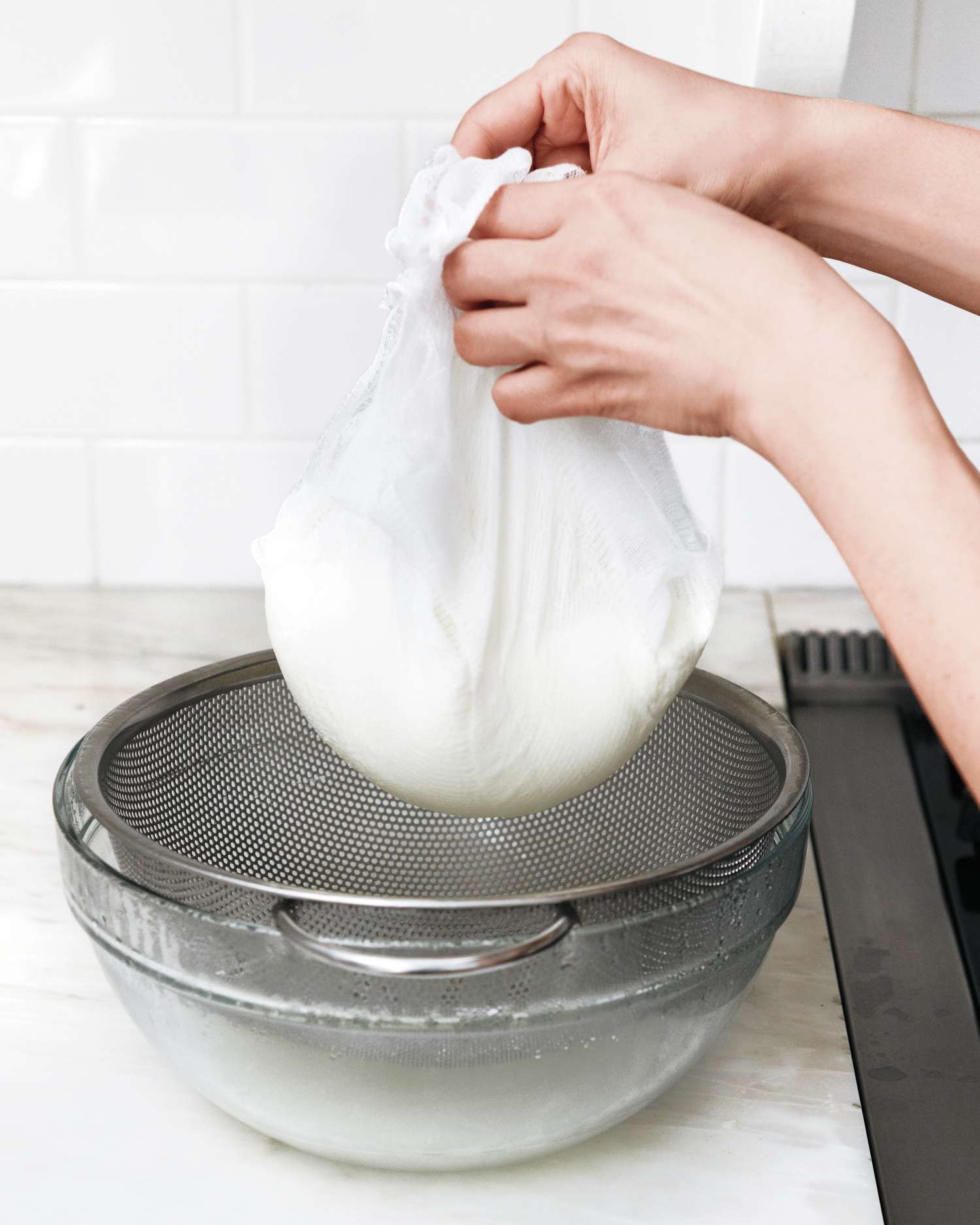 homemade ricotta in cheesecloth