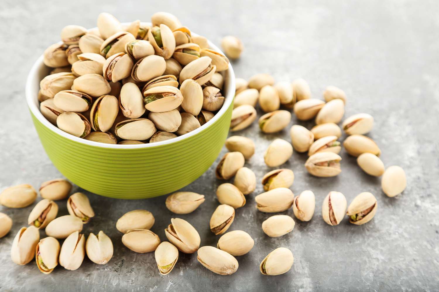 pistachios in green bowl