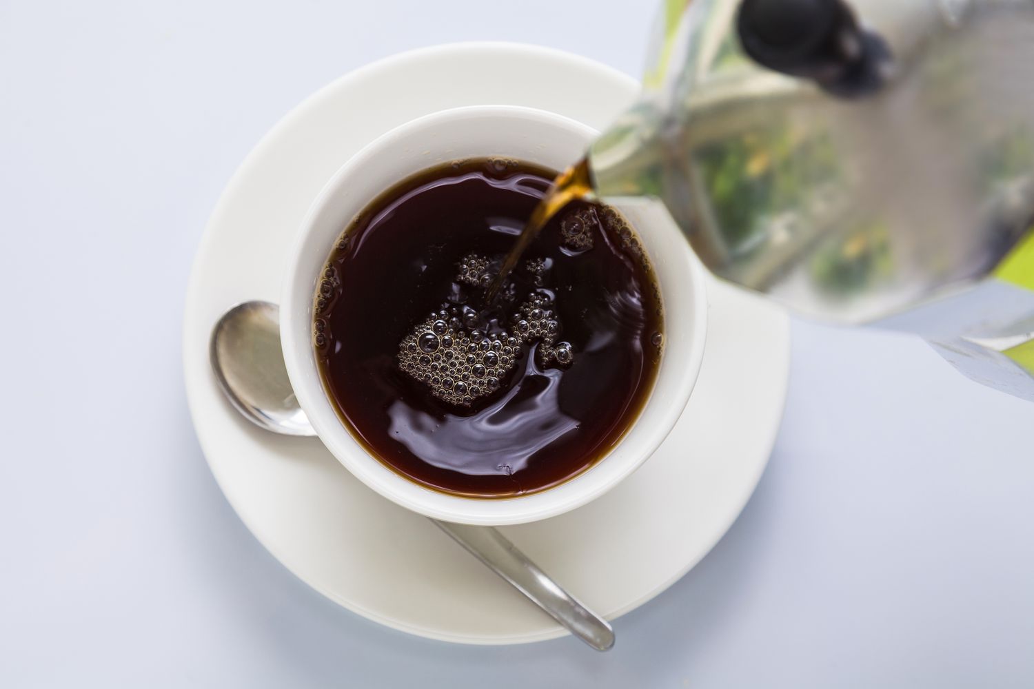 Pouring coffee into mug