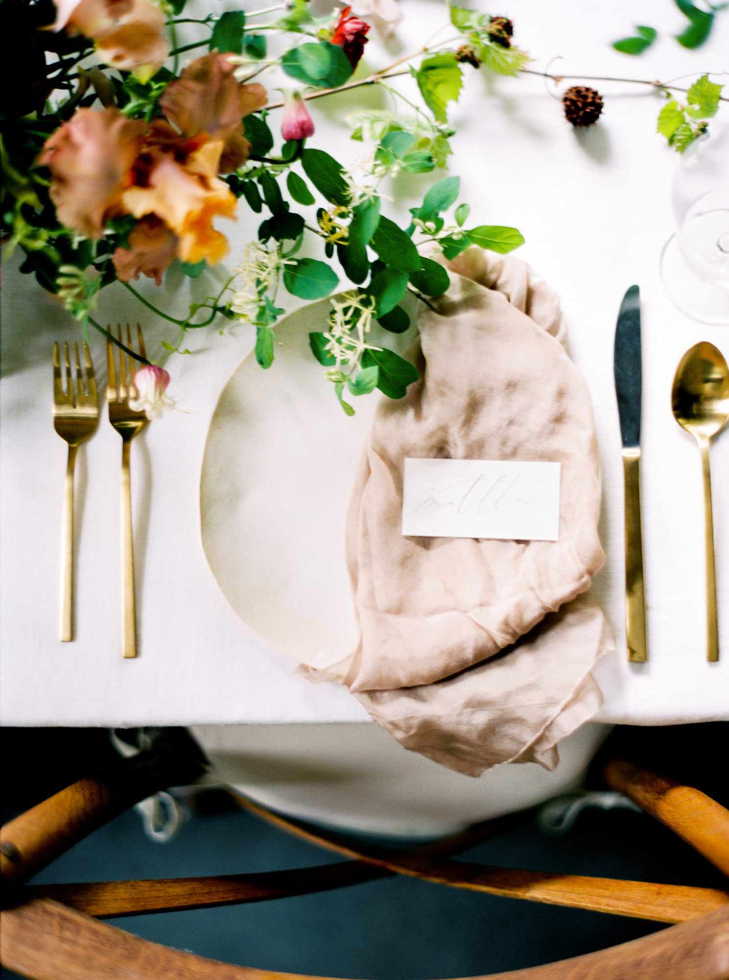 wedding reception napkin folds pink napkin draped on one half of plate