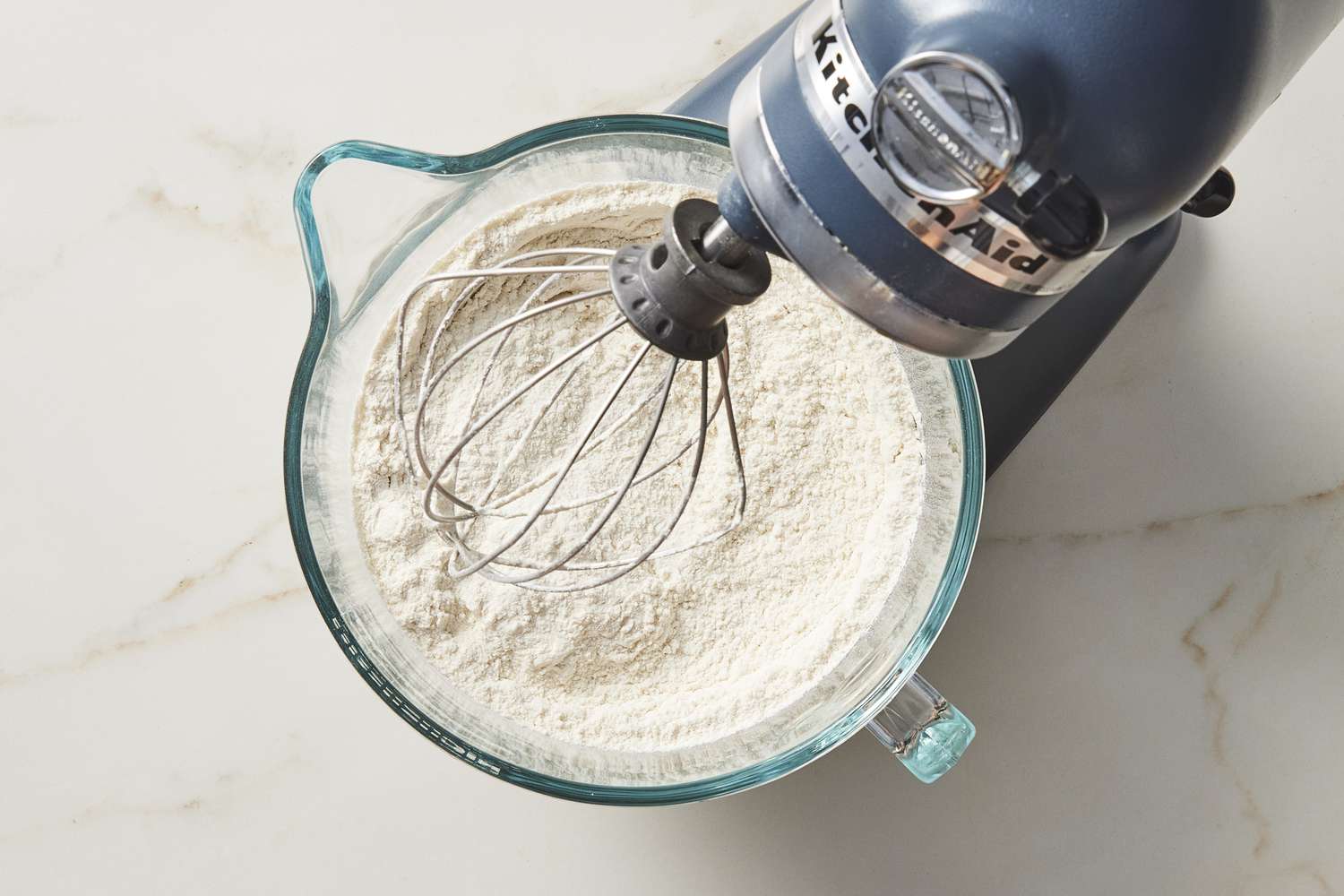 Dry flour in bowl under stand mixer