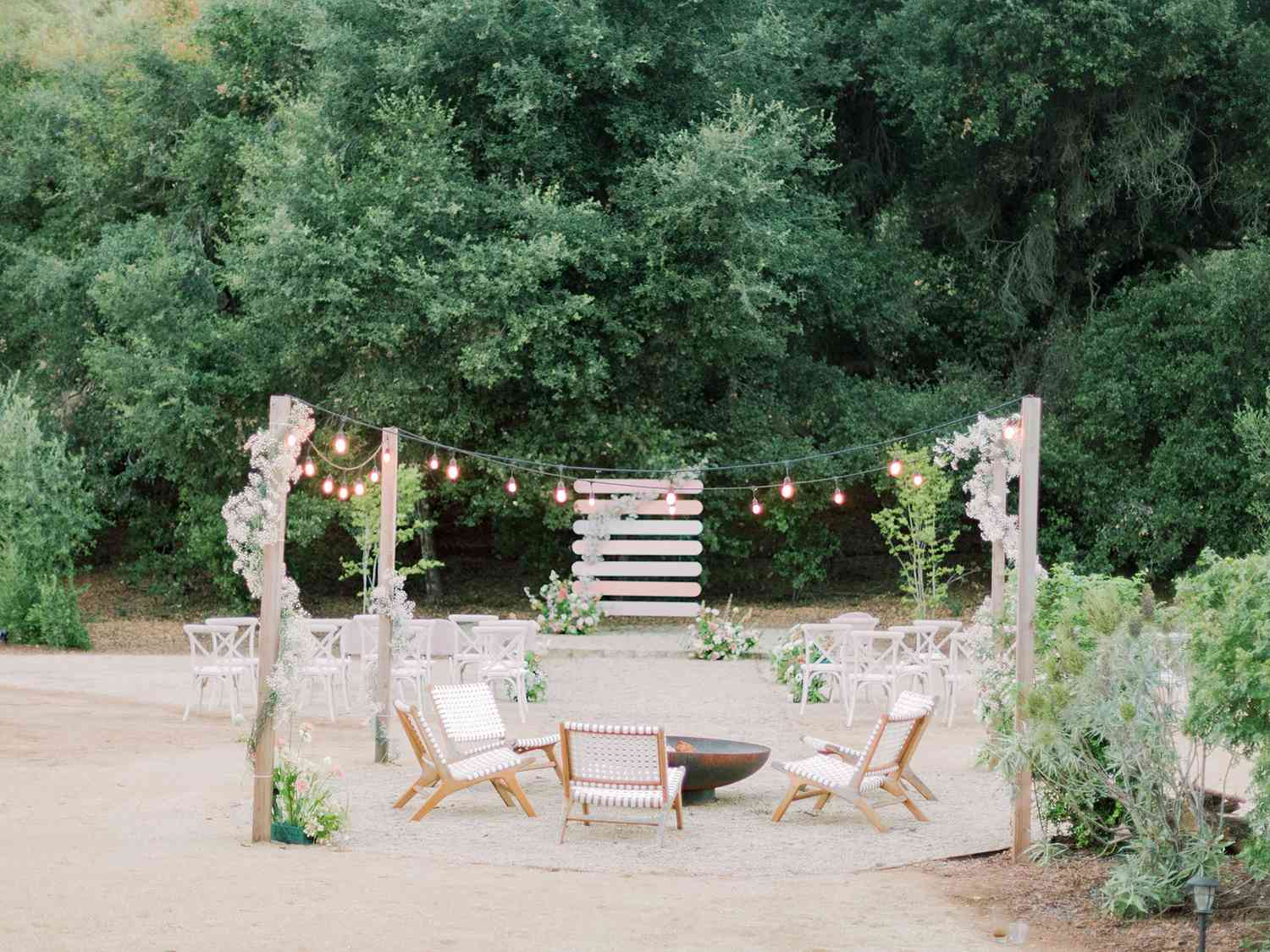 fire pit seating area outside behind wedding ceremony space