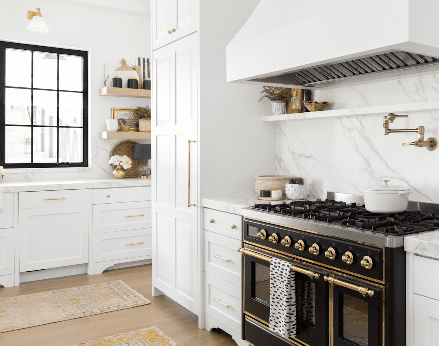 White kitchen with black stove