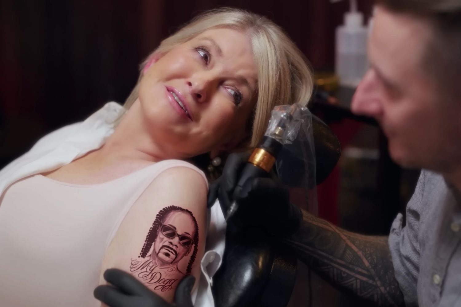 decorvow being tattooed with Snoop Dogg's face for a Superbowl 2023 commercial