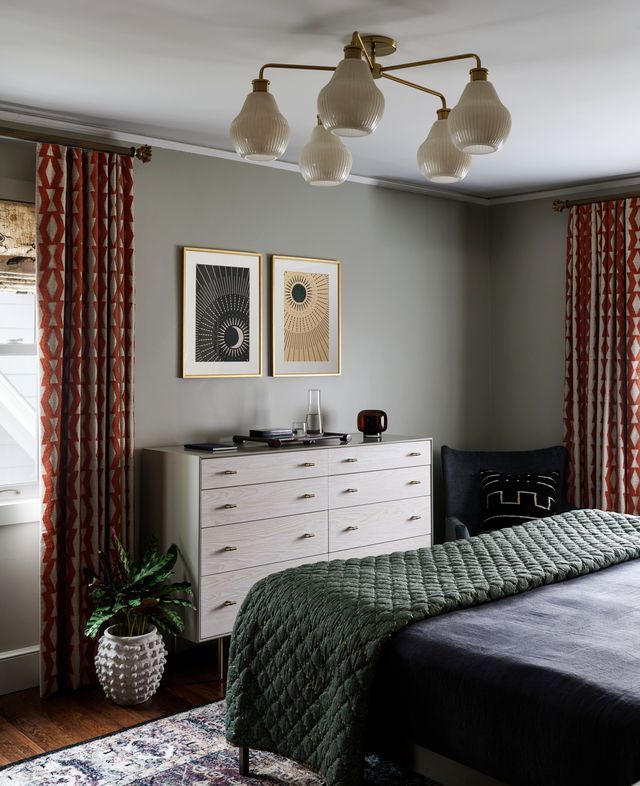 Dresser at the foot of a bed