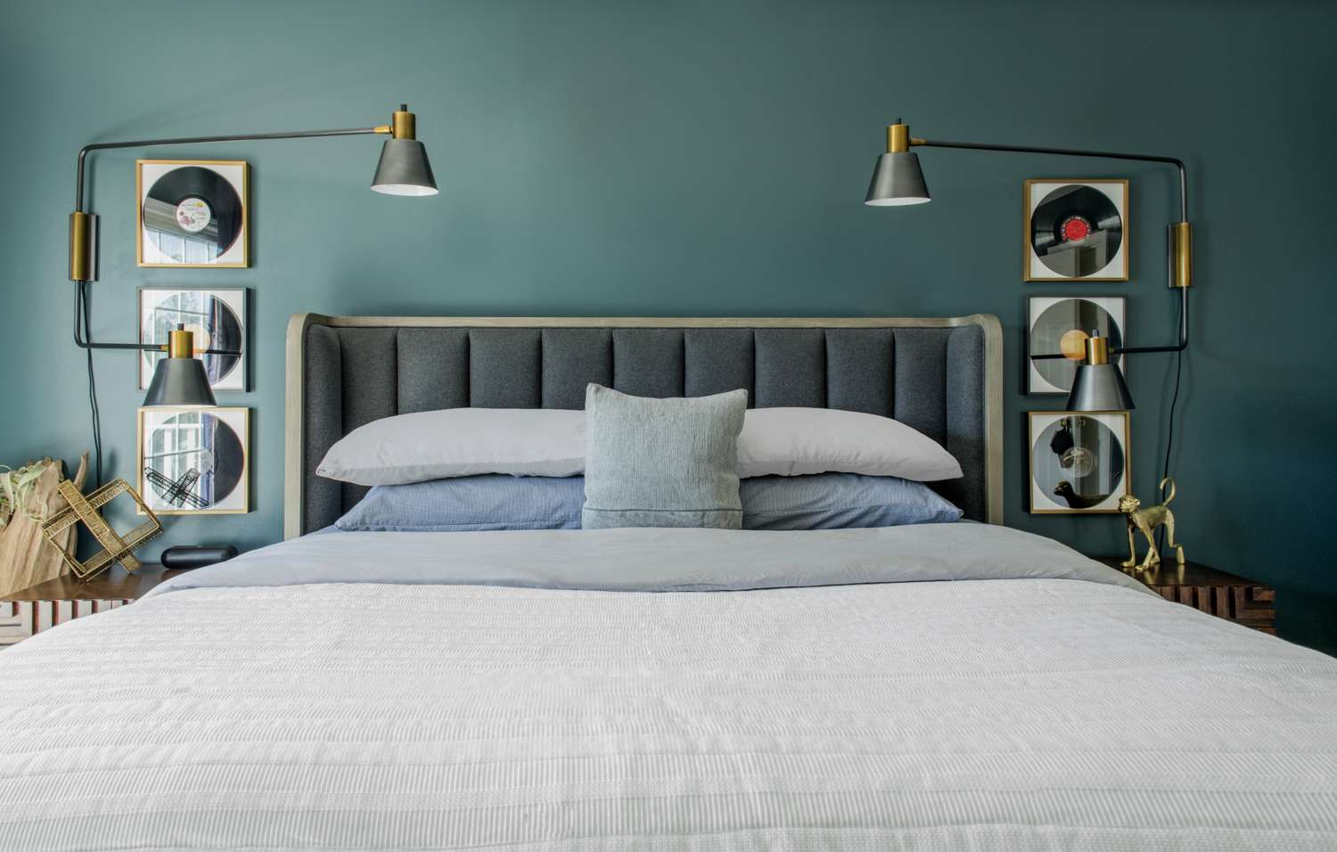 Blue bedroom with tall sconces