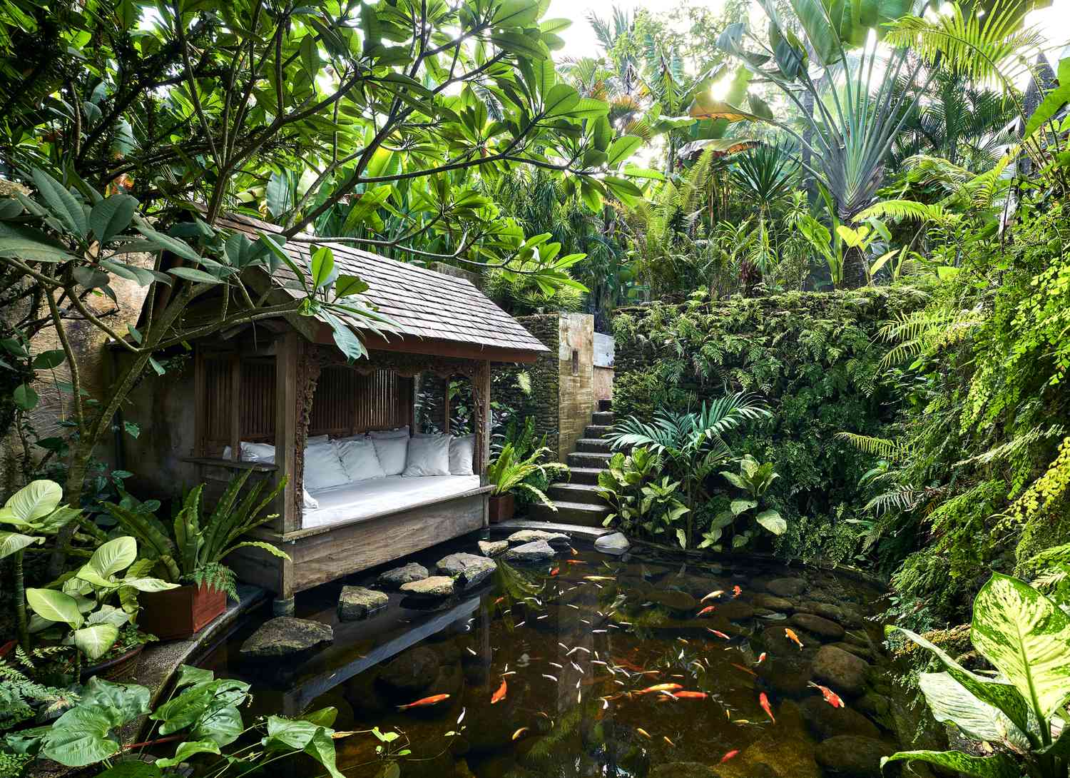 lush koi pond with seating