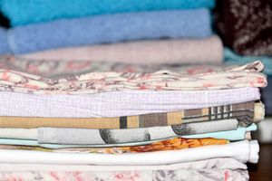 Stack of folded linens in a thrift store display