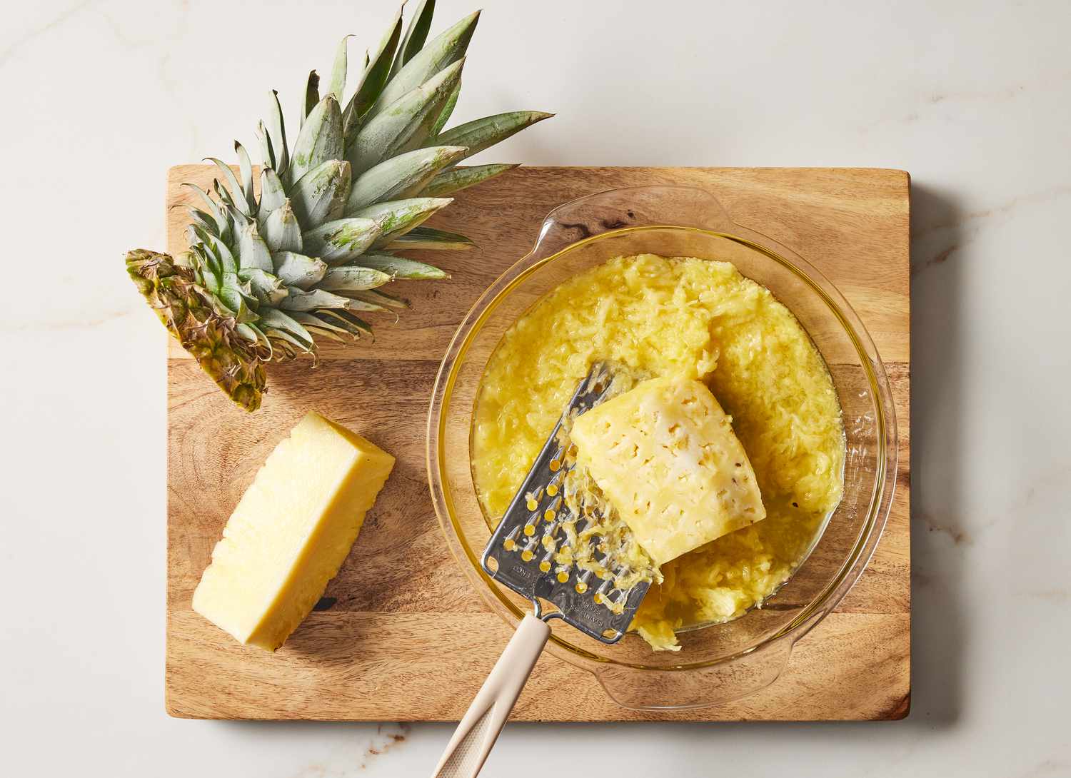 cutting board with fresh grated pineapple