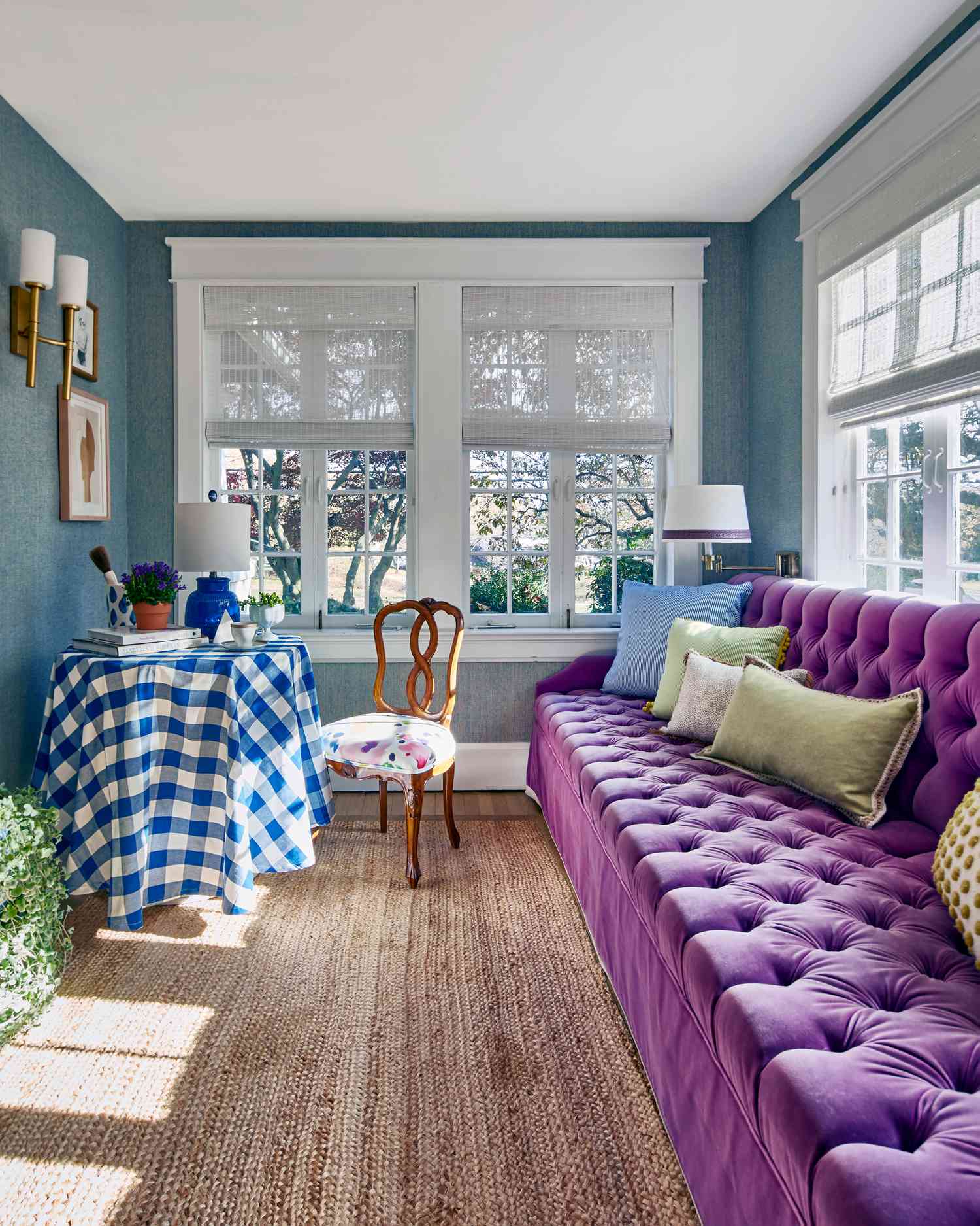 Enclosed porch with bold color sofa 