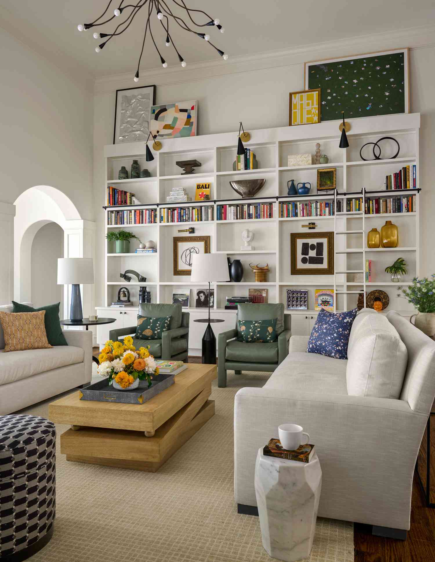 A white living room with bookshelves