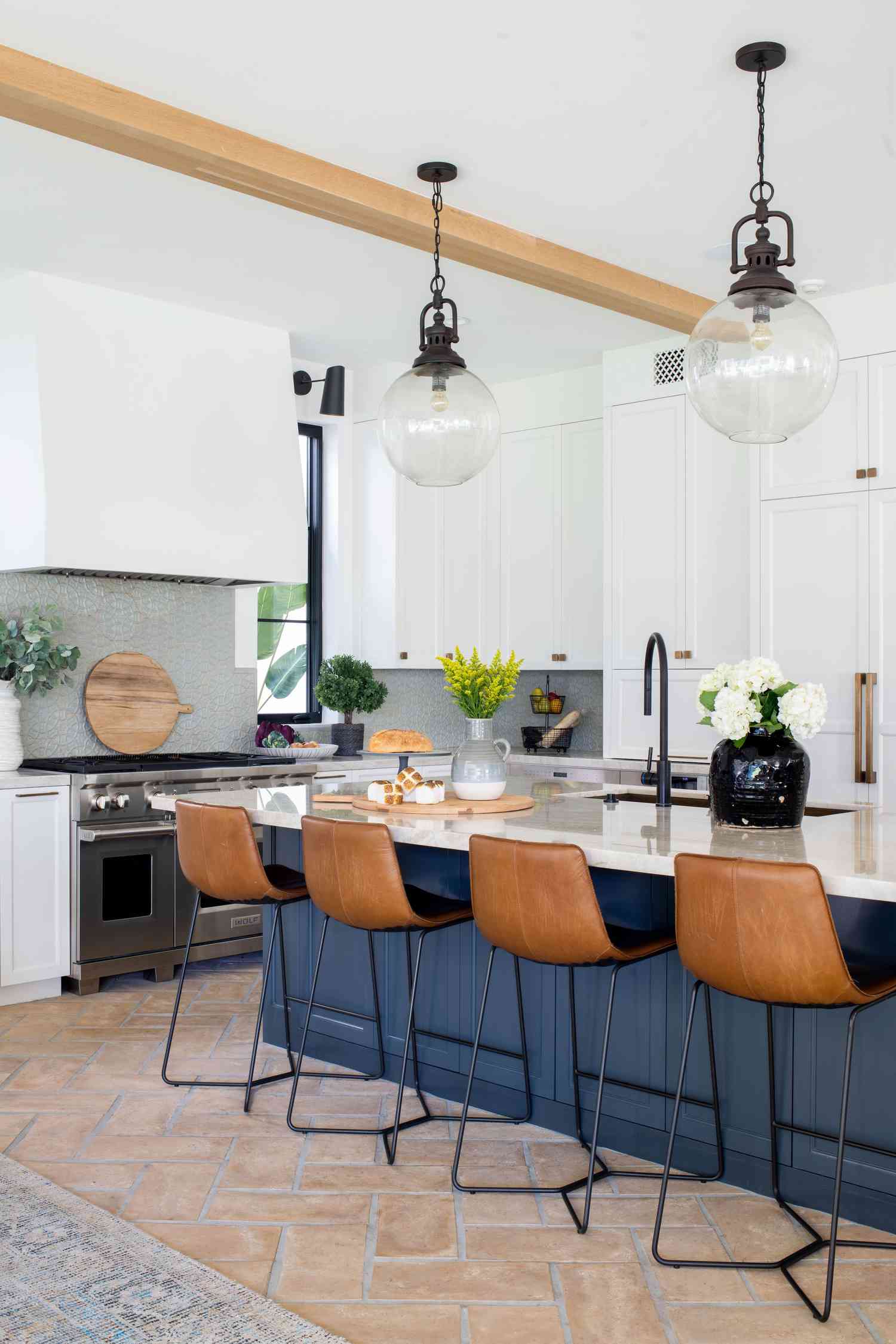Kitchen with blue island cabinets
